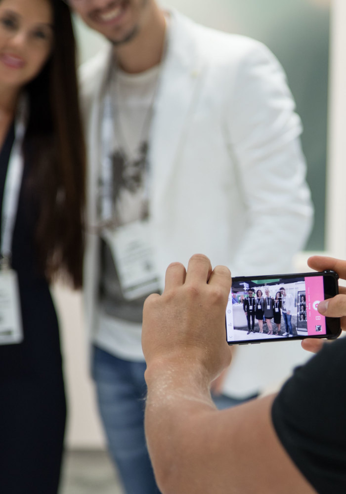 amiea experts selfie amiea artists taking selfies at an event